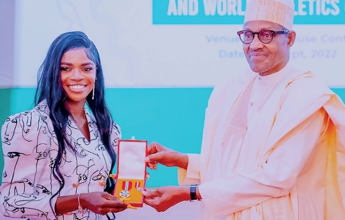 Tobi Amusam receives award from Buhari