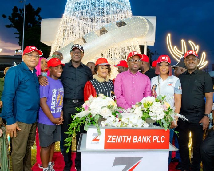The Group Managing Director/CEO of Zenith Bank Plc, Mr Ebenezer Onyeagwu (3rd Right) flanked by the wife of the Founder and Chairman of Zenith Bank Plc, Mrs Kay Ovia (4th Left); Executive Director, Mr Dennis Olisa (1st Left); Executive Director, Dr Temitope Fasoranti (3rd Left); Executive Director, Mrs Adobi Nwapa (2nd Right); and Executive Director, Mr Henry Oroh (1st Right) at the 2022 Zenith Bank Christmas Light-Up of Ajose Adeogun Street, Victoria Island on Saturday, November 19.