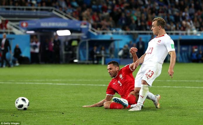 Xhedan Shaqiri for Switzerland scores against Serbia