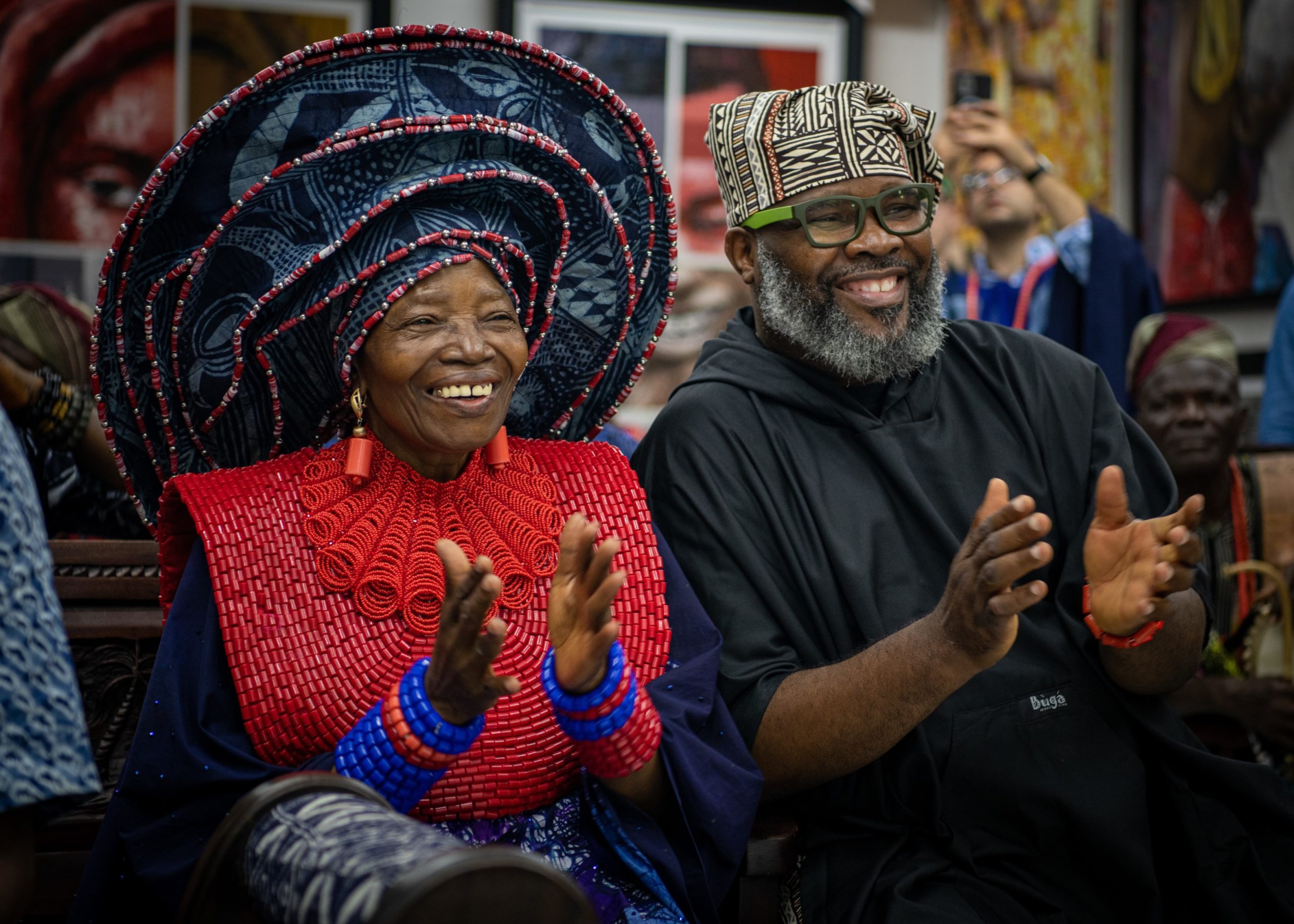 Chief Dr. Nike Davies-Okundaye, left, and Jesse King Buga applaud during a performance - THEWILL NEWS MEDIA