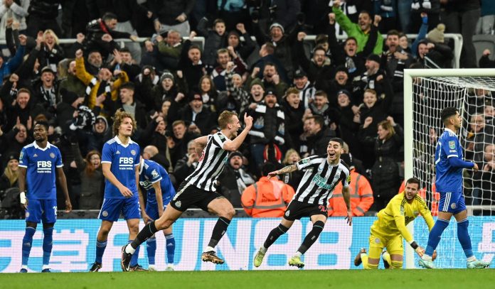 Dan Burn of Newcastle celebrates after scoring against Leicester city