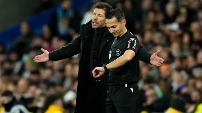 Simeone and a referee