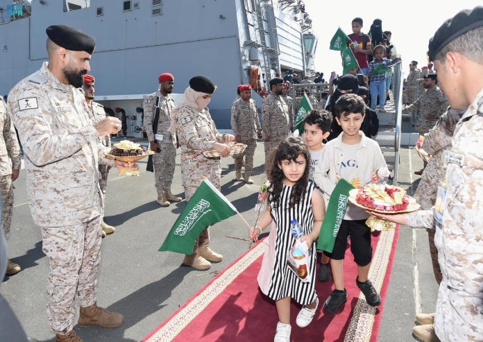 Citizens of Saudi Arabia and people from other nationalities are welcomed by Saudi Royal Navy officials as they arrive after being evacuated from Sudan at Jeddah Sea Port