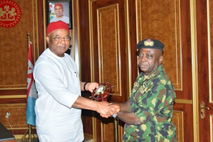 Governor Hope Uzodimma of Imo State (left), receives a souvenir from the Chief of Naval Staff, Vice Admiral Emmanuel Ikechukwu Ogalla