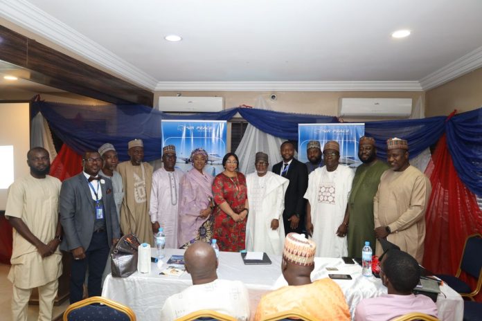 The Ground Operations Manager, Air Peace, Ayodeji Adeyemi (middle), flanked by guests and key travel agents in Kano recently.