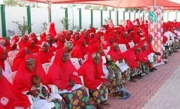 A cross section of just-wedded couples of the Kano State Government-sponsored Mass Wedding at a reception held at a the Government House, Kano,on Saturday. A cross section of just-wedded couples of the Kano State Government-sponsored Mass Wedding at a reception held at a the Government House, Kano,on Saturday.