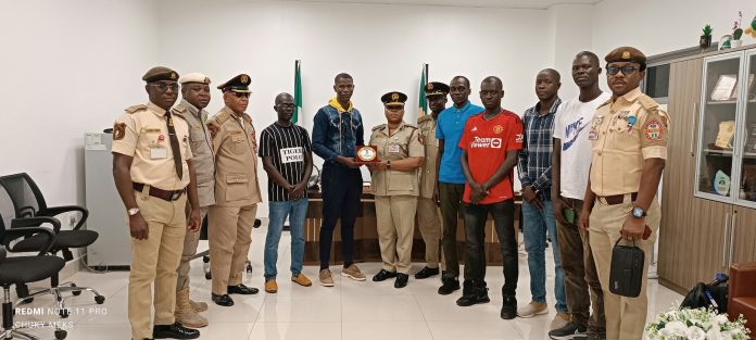 The Comptroller MMIA Command CIS Adesola Adesokan with the Team leader from the Gambian Immigration service.