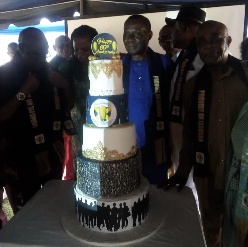 Members of ISSOSA with the Anniversary cake. - THEWILL NEWS MEDIA