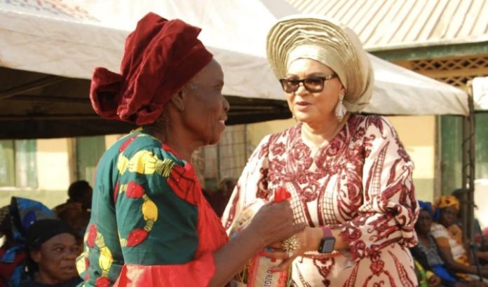 The founder of Jedidiah Divine Home of Love (JEDLOF), Dr (Mrs) Ebele Okoye presenting some of the items to the beneficiaries in Enugu, Enugu State recently