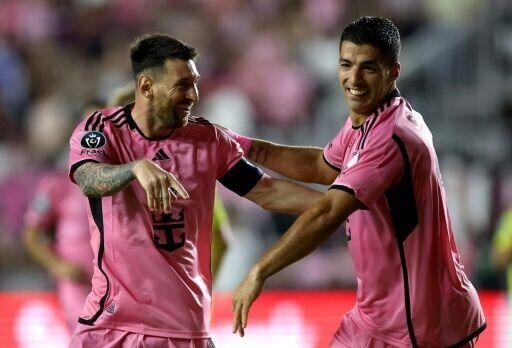 Lionel Messi celebrates with Luis Suarez Lionel Messi celebrates with Luis Suarez