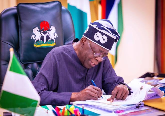 Tinubu signs tinubu