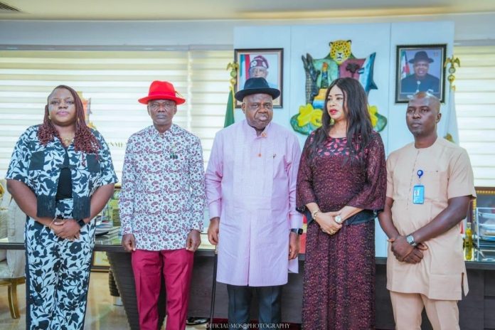 Leader of the UNDP team, Joyce Oboro, who presented a cheque to Governor Douye Diri