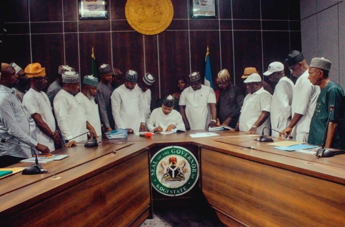 Governor-Ododo-signing-the-bills-into-law