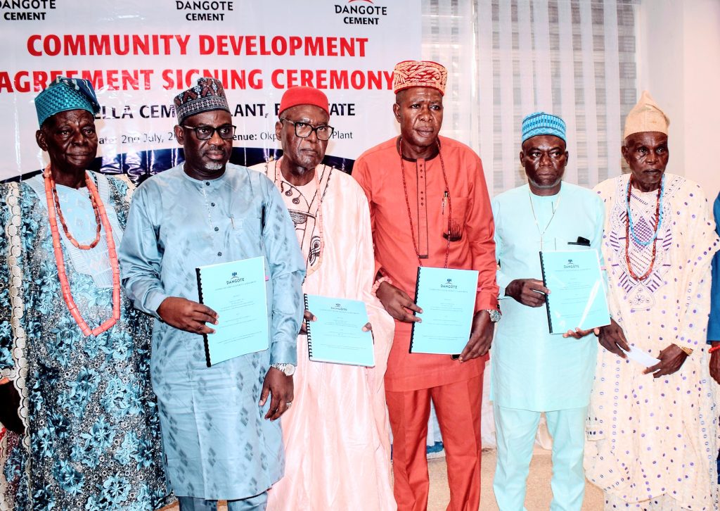 (L-R): _High Chief Daniel O. Obalo; Engr. Mohammed Ismaeel, Dangote Cement Plc, Okpella Plant Director; Chief Moshood Aliu; Chief Peter Afiabor; Chief Eshiofune Okpetu and Chief Paul Ilabeshi, all host communities leaders_ _at the official signing and presentation of the first Community Development Agreement (CDA) between Dangote Cement Okpella Plant and Okpella Host Communities held at the plant at Okpella Edo._ - THEWILL NEWS MEDIA (L-R): _High Chief Daniel O. Obalo; Engr. Mohammed Ismaeel, Dangote Cement Plc, Okpella Plant Director; Chief Moshood Aliu; Chief Peter Afiabor; Chief Eshiofune Okpetu and Chief Paul Ilabeshi, all host communities leaders_ _at the official signing and presentation of the first Community Development Agreement (CDA) between Dangote Cement Okpella Plant and Okpella Host Communities held at the plant at Okpella Edo._