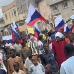 OPINION: The Russians Are Closing In On Nigeria’s Borders Protesters Russia flag in Nigeria