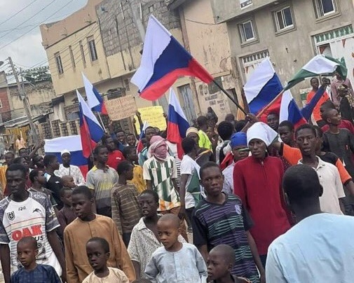 Protesters Russia flag in Nigeria