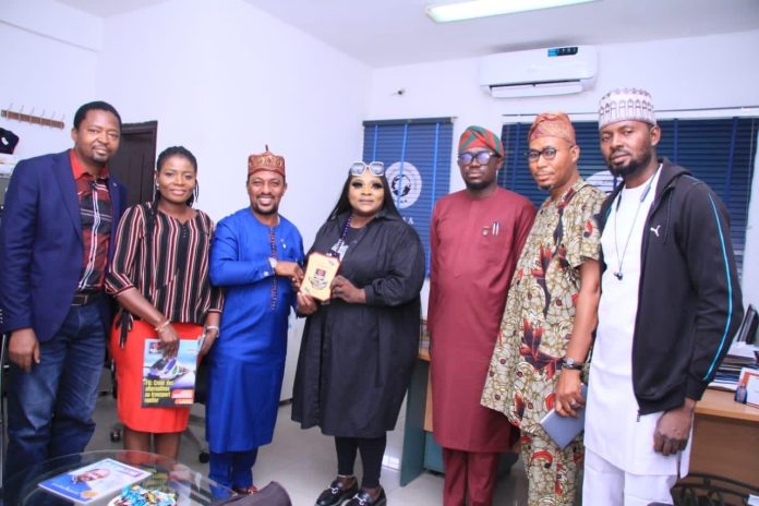 Lagos Regional Manager, Nigeria Civil Aviation Authority (NCAA), Barr. Bukola Teriba, (middle), receiving an award of commendation on behalf of the Ag. DG, Captain Chris Najomo, from the management of Global Transport Policy led by its Chairman/Chief Consultant, Dr. Segun Musa (3rd left) in Lagos. Others are L-R, Mr. Mark Onuchi, GTP, Director, Business Development; Regina Robinson, Editor-in-Chief; Personal Assistant to Ag. DG, NCAA, Mr. Ehima; Dr. Segun Awe-Obe, GTP, Director, Human Resources, and NCAA Head of Estate, Mr. Debisi Saheed. Lagos Regional Manager, Nigeria Civil Aviation Authority (NCAA), Barr. Bukola Teriba, (middle), receiving an award of commendation on behalf of the Ag. DG, Captain Chris Najomo, from the management of Global Transport Policy led by its Chairman/Chief Consultant, Dr. Segun Musa (3rd left) in Lagos. Others are L-R, Mr. Mark Onuchi, GTP, Director, Business Development; Regina Robinson, Editor-in-Chief; Personal Assistant to Ag. DG, NCAA, Mr. Ehima; Dr. Segun Awe-Obe, GTP, Director, Human Resources, and NCAA Head of Estate, Mr. Debisi Saheed.