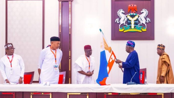Tinubu hands over APC flag to Okpebholo