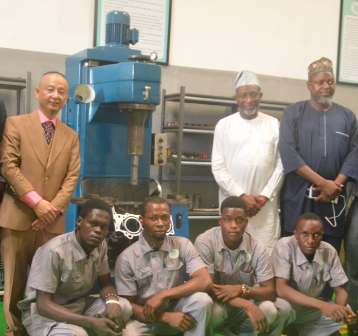 Photo Caption: L-R: MD, Yingqi Auto Machinery Ltd, Vincent Ke; Rector, Yaba College of Technology, Lagos, Dr Ibraheem Adedotun Abdul and Dr Taiwo Ajala, of Yaba College of Technology, with some workers of Yingqi Auto Machinery Ltd during the grand opening of the company in Ojodu Berger, Lagos on Saturday.