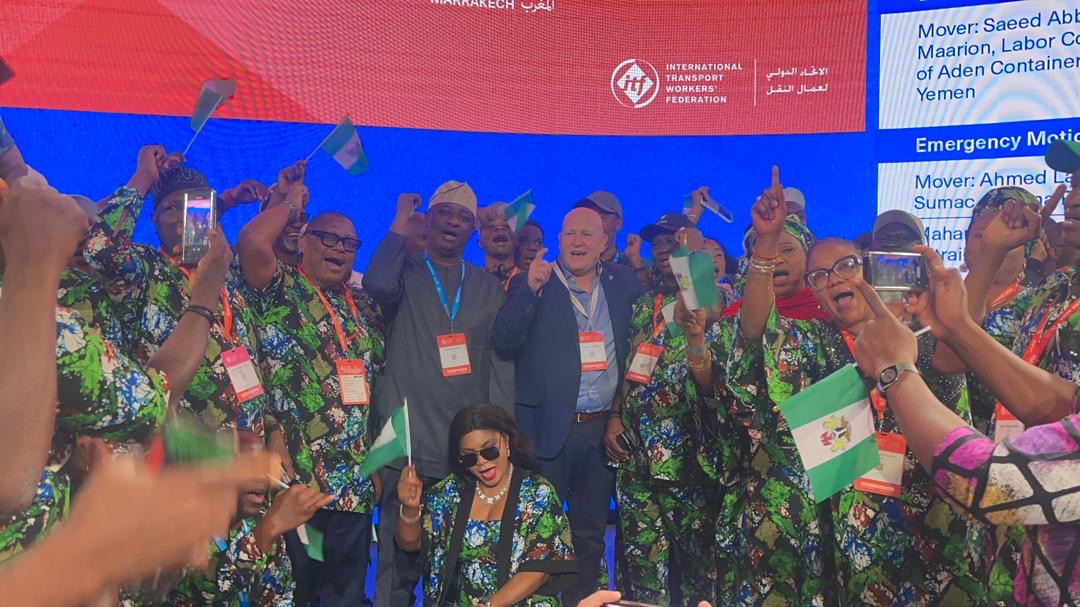 Keyamo Morocco - THEWILL NEWS MEDIA The Honourable Minister of Aviation and Aerospace Development, Festus Keyamo (middle) flanked by labour leaders in the Congress.