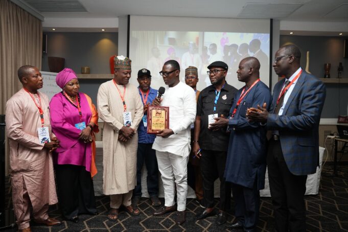 African Regional Secretary of ITF, Comrade Mohammed Dauda Sefiyanu making a presentation of the Award of Excellence to the Aviation Minister, Festus Keyamo, which was received on the Minister's behalf by Director, Special Duties, FAAN, Mr Henry Agbebire, at the 2nd JATUF Conference held in Lagos recently. African Regional Secretary of ITF, Comrade Mohammed Dauda Sefiyanu making a presentation of the Award of Excellence to the Aviation Minister, Festus Keyamo, which was received on the Minister's behalf by Director, Special Duties, FAAN, Mr Henry Agbebire, at the 2nd JATUF Conference held in Lagos recently.