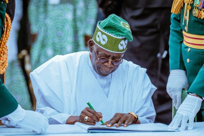 Tinubu Signs Tinubu Signs
