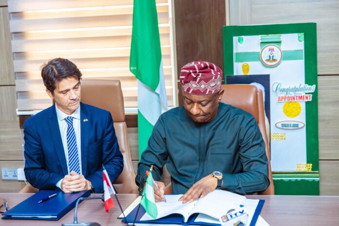 Minister of Aviation and Aerospace Development, Festus Keyamo (right) and the Canadian High Commissioner, Ambassador Pasquale Salvaggio (left) during signing of the BASA agreement on Friday in Abuja.