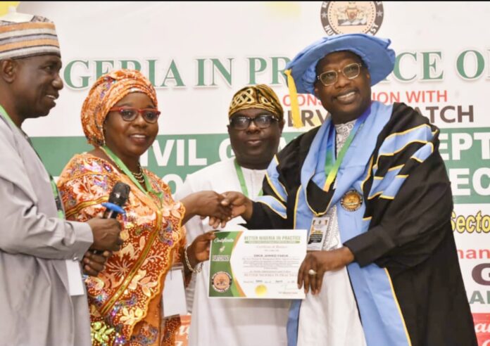 The Managing Director of the Nigerian Airspace Management Agency (NAMA), Engr. Farouk Ahmed Umar (right) receiving the award from members of Better Nigeria in Practice of Good Conduct at the Shehu Musa Yar’Adua Centre in Abuja recently.