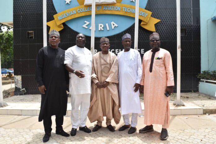 The Rector /Chief Executive of the Nigerian College of Aviation Technology (NCAT), Zaria, Dr Danjuma Ismaila Adamu (middle), Chairman, House Committee on Aviation, Honourable Tajudeen Kareem Abisodun (2nd left) and other Committee members during an oversight visit and facility tour of the College in Zaria recently.