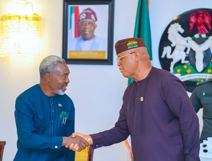 Pic of the Governor of Akwa Ibom State, Pastor Umo Eno, with the Chairman of the Council of the NIPR, Dr. Ike Neliaku, in Uyo.