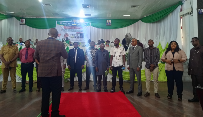 ISPON National President, Timothy Iwuagwu, inducting the 20 new members into the Institute.