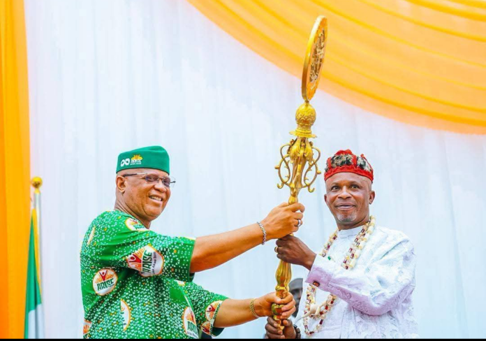 Akwa Ibom State Governor, Pastor Umo Eno, presenting the staff of office to Akuku Saviour Sylvester Udofia, as he takes over as the new Chairman of the State Supreme Council of Traditional Rulers in Uyo, yesterday.