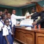 Benue Council Chairman Award N5m Scholarship, Books To Schools Prof Angwe Presenting a Cheque