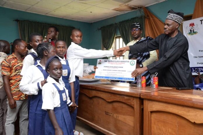 Prof Angwe Presenting a Cheque Prof Angwe Presenting a Cheque