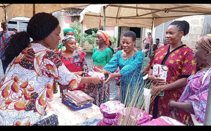Personal Assistant to the Governor of Akwa Ibom State in Ward 7, Itu LGA, Mrs Bright Mbuk, handing a gift to a beneficiary. Personal Assistant to the Governor of Akwa Ibom State in Ward 7, Itu LGA, Mrs Bright Mbuk, handing a gift to a beneficiary.