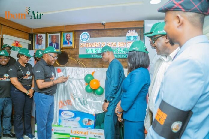 Ibom Air CEO, George Uriesi, while handling over the drugs to the state commissioner for health, Dr Ekem Emmanuel, in Uyo Ibom Air CEO, George Uriesi, while handling over the drugs to the state commissioner for health, Dr Ekem Emmanuel, in Uyo