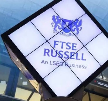 Tilted cube sign displaying the FTSE Russell logo and the words 'An LSEG Business' with a blue crest above.