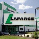Q1 2026: Lafarge Africa Plc Records N97.95 billion Profit Exterior view of a Lafarge building with a large white sign featuring the green Lafarge logo and name Caution: large corporate sign in front of the entrance.