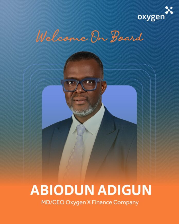 Welcome on board banner featuring Abiodun Adigun, MD/CEO Oxygen X Finance Company, in a navy suit against a blue gradient background with logo