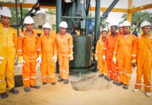 OPINION:Why Akwa Ibom’s ₦7.38bn Bet On Women Could Redefine Grassroots Development BY Ekaette Okon-Joseph Group of workers in orange coveralls and white hard hats standing around a large drilling machine outdoors.