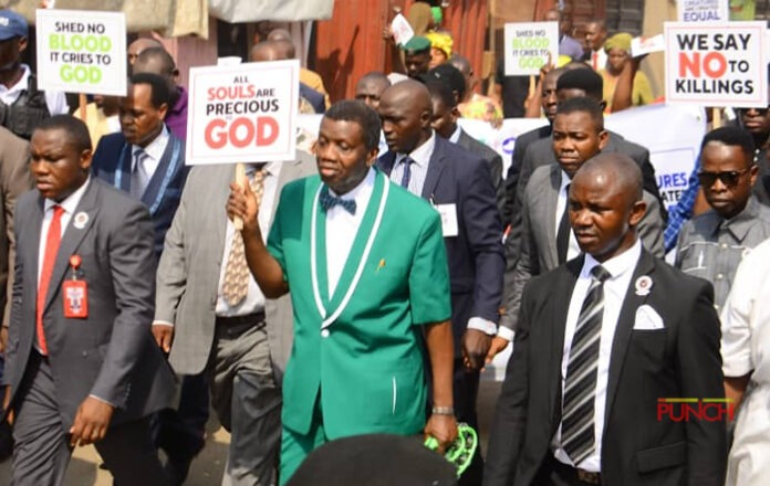 Pastor Enoch Adejare Adeboye, was seen carrying a placard in a viral photograph