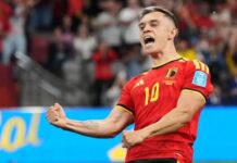 W’Cup: Belgium End Group Stage in Style with Five-Star Victory Over New Zealand Belgian national team soccer player in a red jersey #10 celebrating with a fist pump on the field; stadium crowd in background.