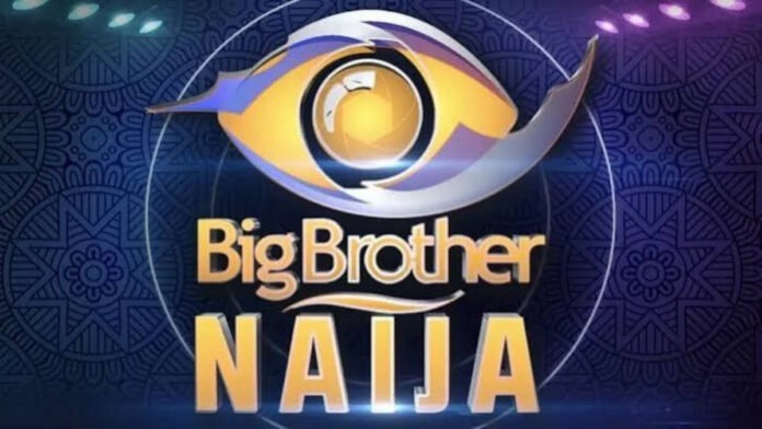 BBN Logo Big Brother Naija logo with a stylized eye emblem above bold gold text on a dark blue patterned background