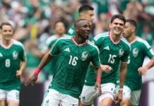Mexico Beat Ecuador To Keep Co-Hosts’ World Cup Dream Alive Group of soccer players in green jerseys celebrate on the field, led by #16 player.