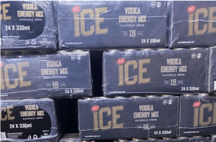 Stacks of blue boxes labeled ICE, Vodka Energy Mix, 24 x 330 ml, arranged on a pallet (retail display)
