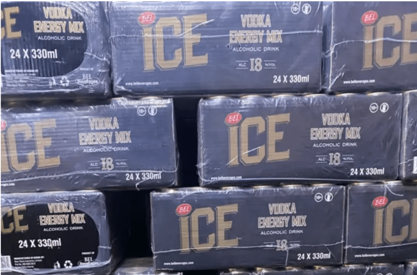 Stacks of blue boxes labeled ICE, Vodka Energy Mix, 24 x 330 ml, arranged on a pallet (retail display)
