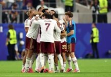 5 Reasons Spain Outclassed France To Reach 2026 FIFA World Cup Final Soccer players in white and maroon jerseys huddle together on the green pitch, Ferran Torres wearing number 7 at the center.