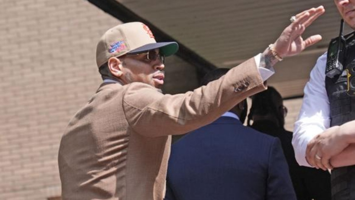 Brown arrived at court wearing a tan suit, gold-rimmed sunglasses, and a baseball hat. Credit: Stefan Rousseau/PA) - THEWILL NEWS MEDIA