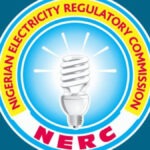 Who Controls Nigeria’s Electricity Market? NERC’s New Order Sparks Battle Over Regulatory Powers Logo of the Nigerian Electricity Regulatory Commission (NERC): a blue circular emblem with a glowing light bulb, surrounded by a yellow ring with red text and red 'NERC' at the bottom edge.