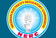 Who Controls Nigeria’s Electricity Market? NERC’s New Order Sparks Battle Over Regulatory Powers Logo of the Nigerian Electricity Regulatory Commission (NERC): a blue circular emblem with a glowing light bulb, surrounded by a yellow ring with red text and red 'NERC' at the bottom edge.